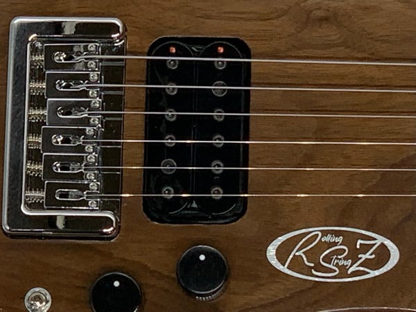 Closeup of Walnut Trouper with Compact Peachtree Bridge in Chrome 